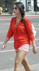 Babe in pink shorts walking showing a bit of cleavage and almost a nip slip