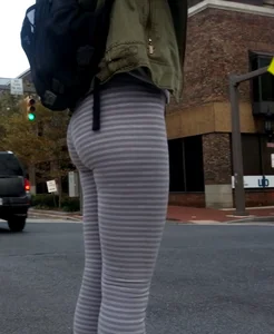 College girl in striped leggings walking with nice ass
