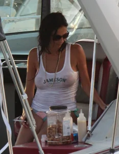 Bikini babe on a boat with a wet see through white shirt showing her tits