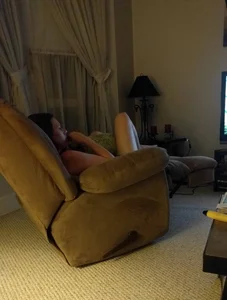 Candid Girlfriend in Panties Curled Up on a Couch at Home