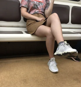 Amazing Hot Girl in a Skirt and Sneakers Sitting Cross-Legged in the Subway Train and on the Escalator Candid Photos Gallery