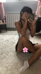 Hot Skinny Girl in a Skirt And Socks Home Selfie in the Mirror