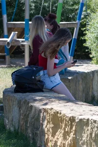 Pretty candid girls with nice legs sitting in denim shorts
