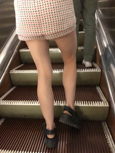 Amazing Long And Slim Legs of a Candid Girl Standing on the Subway Escalator