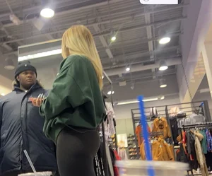 Blonde Finish line store worker in black leggings