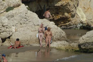 Girls on a nude beach in Sitges, Spain