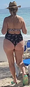 Milf in bikini with her friend at the beach bar