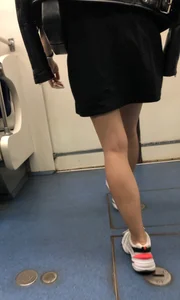 Blonde in a Dress and Sneakers With Sexy Skinny Legs in the Subway Train and on the Escalator Closeup Candid Photos