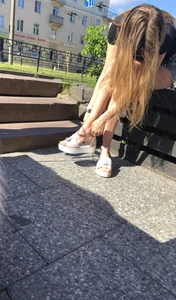 Girl in Denim Shorts with Amazing Hot Legs Fixing Her Sandals Street Candid Photo Gallery