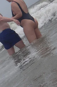 Thick blonde on the beach with a big booty in a blue swimsuit