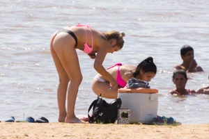Candid beach girls in thongs
