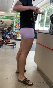 in purple Lycra shorts…