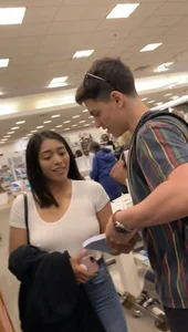 Pretty babe in tight jeans showing nipples in book store w bf (Not OC)(Face shot)