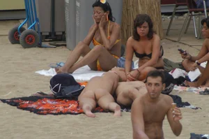 Topless girls on a beach in Barcelona