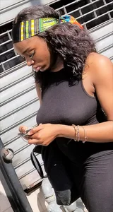 Sexy braless ebony babe in tight skirt with pokies