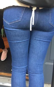 2 nice asses in tight jeans standing around