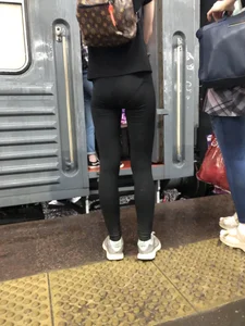Teen Girl in Tights And Sneakers Standing on the Train Platform VPL Photos