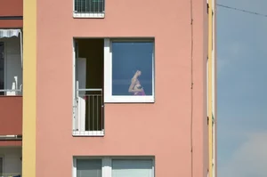 Peeping Tom pics of a topless girl in her house with nice tits