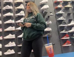 Blonde Finish line store worker in black leggings