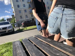 Girl in Denim Shorts with Amazing Hot Legs Fixing Her Sandals Street Candid Photo Gallery