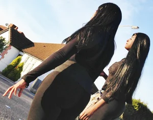 2 sexy black girls in leggings with nice asses