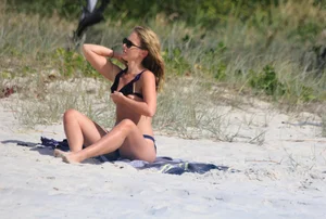 Sexy girls topless on a nude beach showing their nice tits