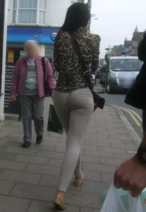 Brunette lady with a nice ass in light grey leggings walking