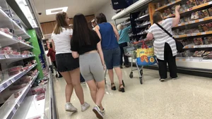 Cute brunette shopping with a nice ass in tight grey shorts with a wedgie