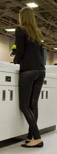 Pretty car saleswoman in tight shiny black pants with nice ass