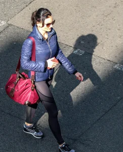 Brunette lady in leggings out walking