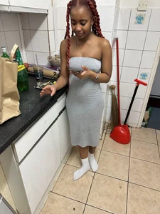 Very cute girl wearing a long tight grey dress kitchen creepshots