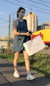 Cute Girl in Denim Dress Legs Closeup
