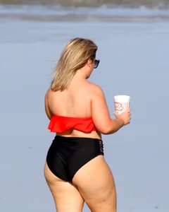 Thick BBW blonde lady in a bikini at the beach