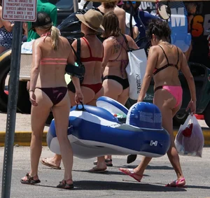 Girls in bikinis getting ready for tubing