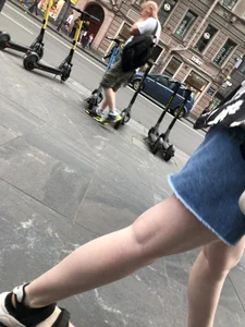 Hot pale legs of a candid girl crossing the street