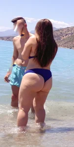 Thick lady at the beach in little blue bikini with big ass