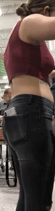 Latina in Maroon crop top and tight black jeans