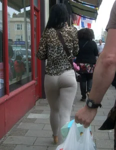 Brunette lady with a nice ass in light grey leggings walking