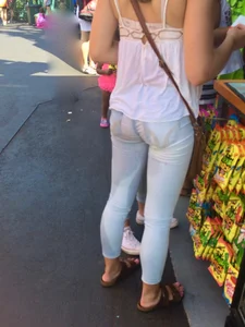 Girl in wet jeans making them semi see through