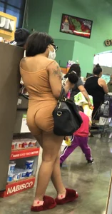 Latina with hard nipples and a big booty in tight spandex shorts outfit