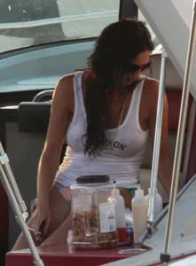 Bikini babe on a boat with a wet see through white shirt showing her tits