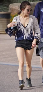 Cutie walking her dog in short denim shorts and showing a bit of cheek