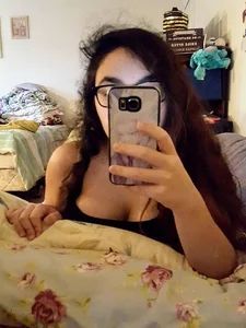 Chubby Bespectacled Girl Taking Selfies in Her Underwear