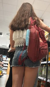 Teen with sexy legs in short jean shorts