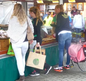 Some milfs in tight jeans on the street market