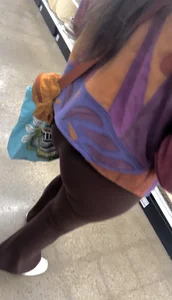 Brunette in maroon flare leggings