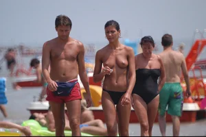 Girls on a nude beach in Bibione, Italy