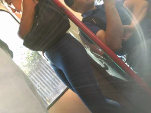 Train girl in tight jeans with a nice ass standing around