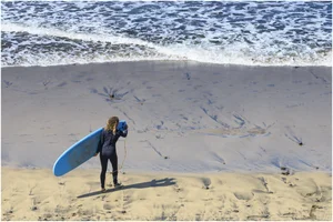 Candid surfer babes on the beach and in bikinis