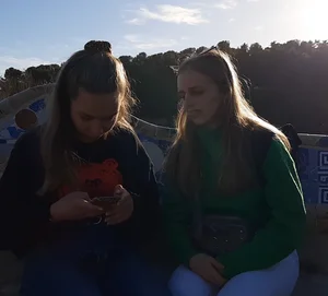 Two beautiful teens in jeans. One white and one blue jeans